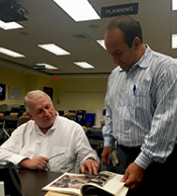 Major Phil May with Ruben D. Almaguer 